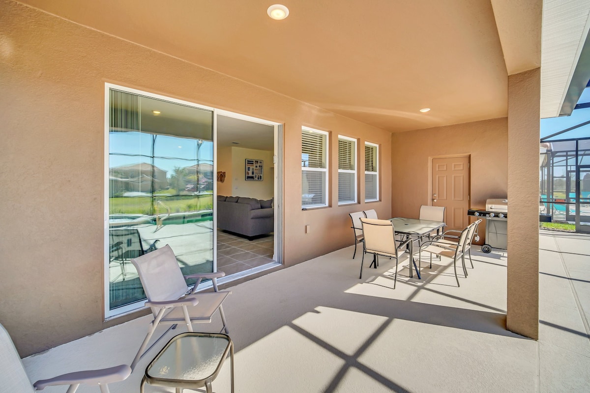 Enjoy alfresco dining on the spacious patio with a grill, perfect for gatherings by the pool.
