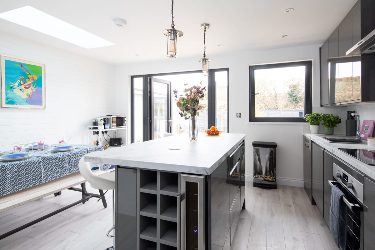 Large kitchen island is a perfect gathering place.