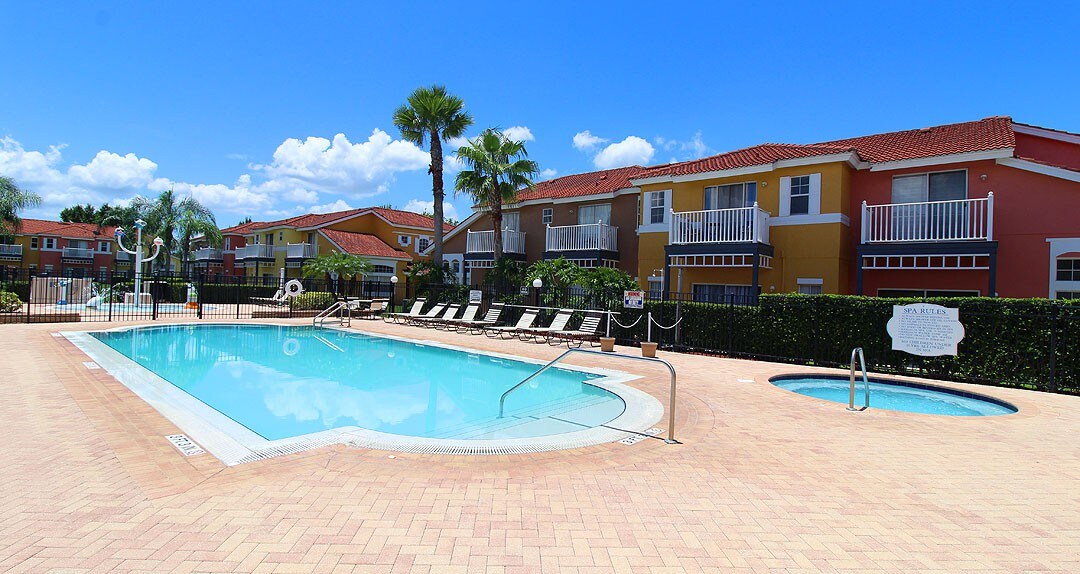 Community pool and in-ground hot tub located in the community club house.
