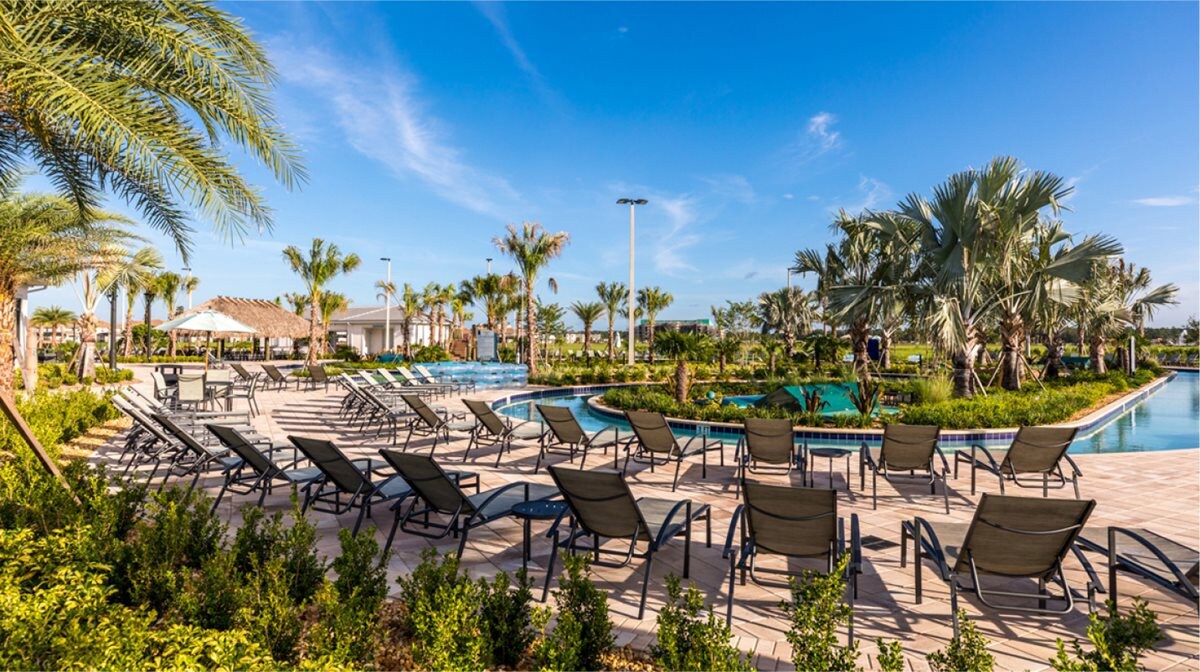 Swimming Pool: The gorgeous, resort-style swimming pool is the perfect place to relax on a summer day with lounge chairs and palm trees