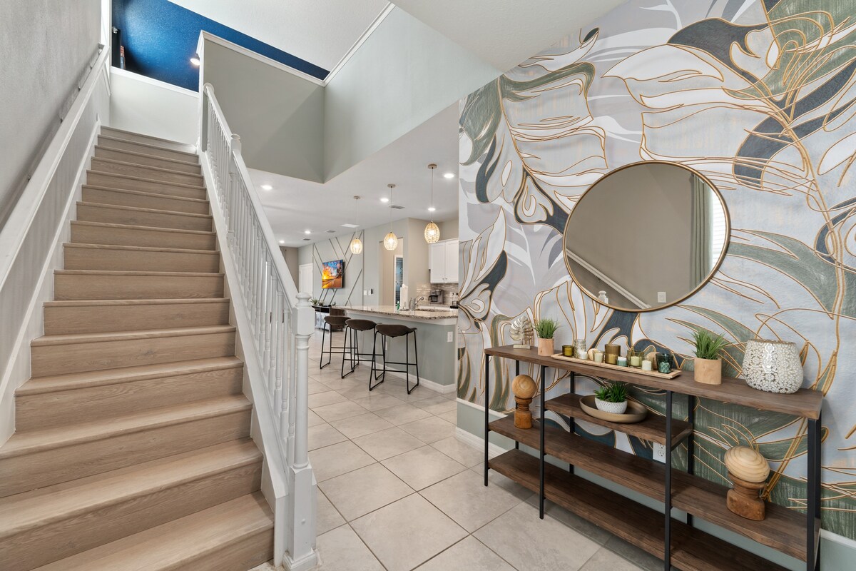 Staircase view highlights an open layout w/ light-filled interior details.