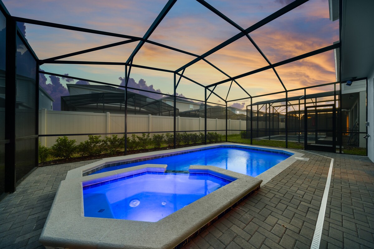Evening pool lighting sets a relaxing mood for nighttime swims.