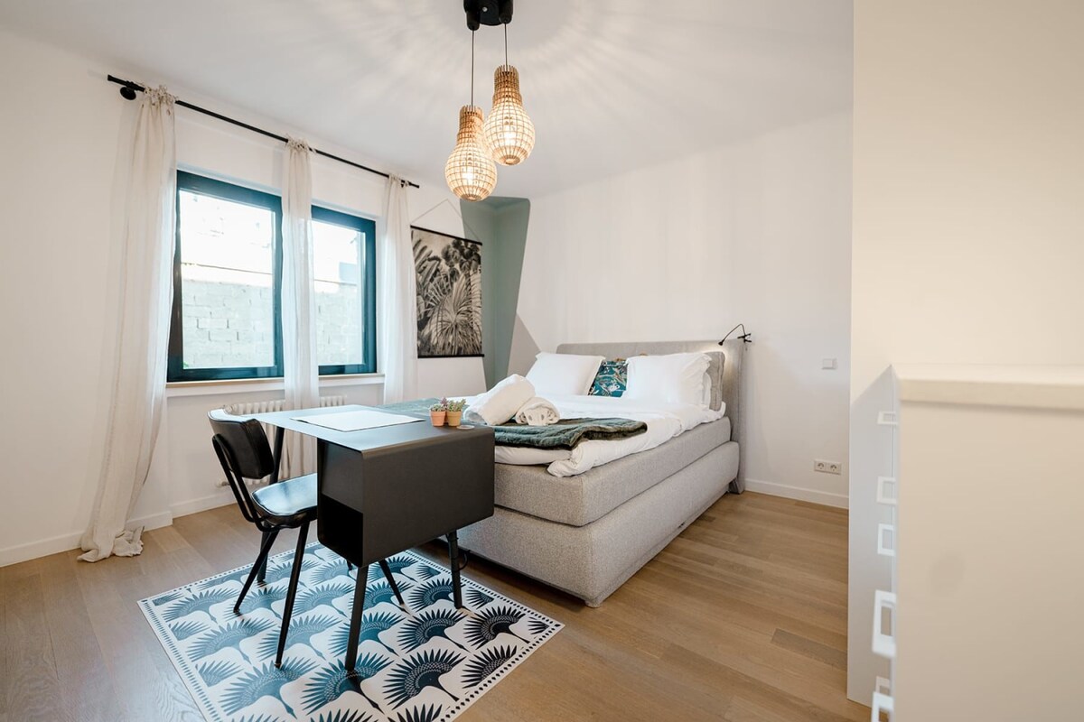 Bedroom 2 also features unique decor, a queen bed & a desk