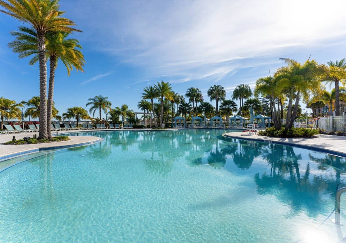 Grand temperature-controlled pool with lots of lounging space, and tanning areas.