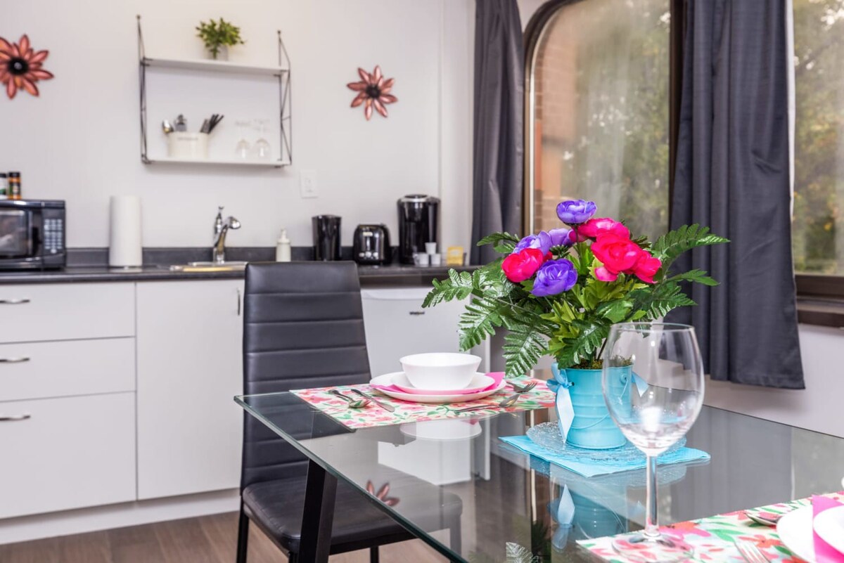 Dine In Elegance With A Beautiful Table Setting And Vibrant Flowers