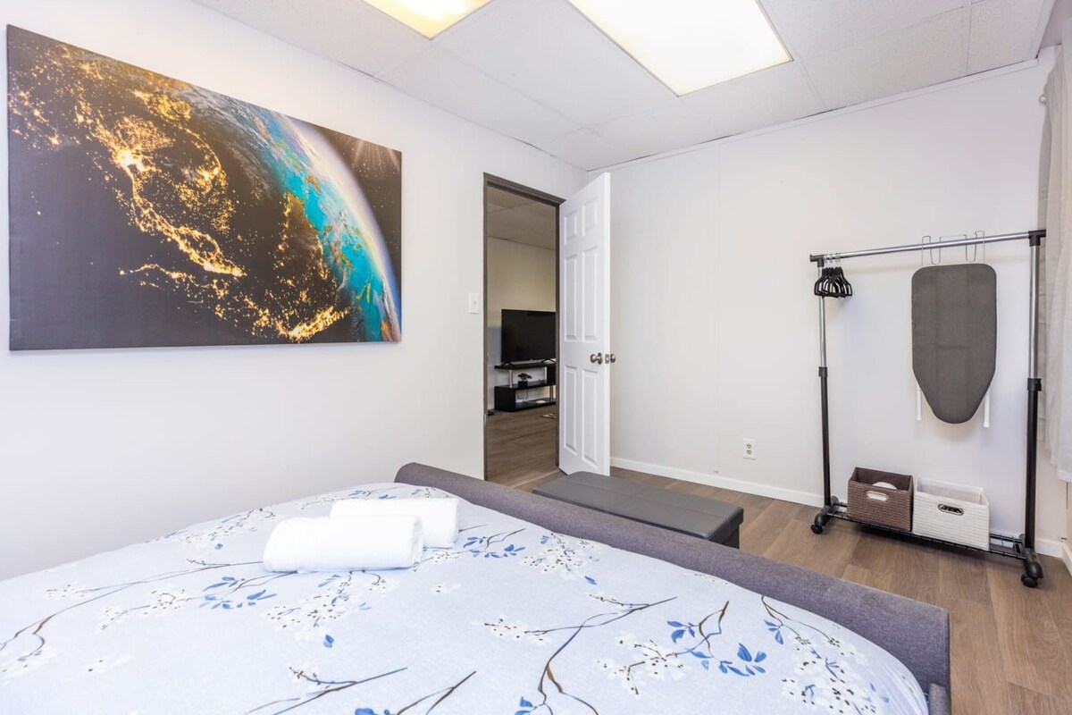 Modern Bedroom With Stunning Wall Art And Convenient Amenities