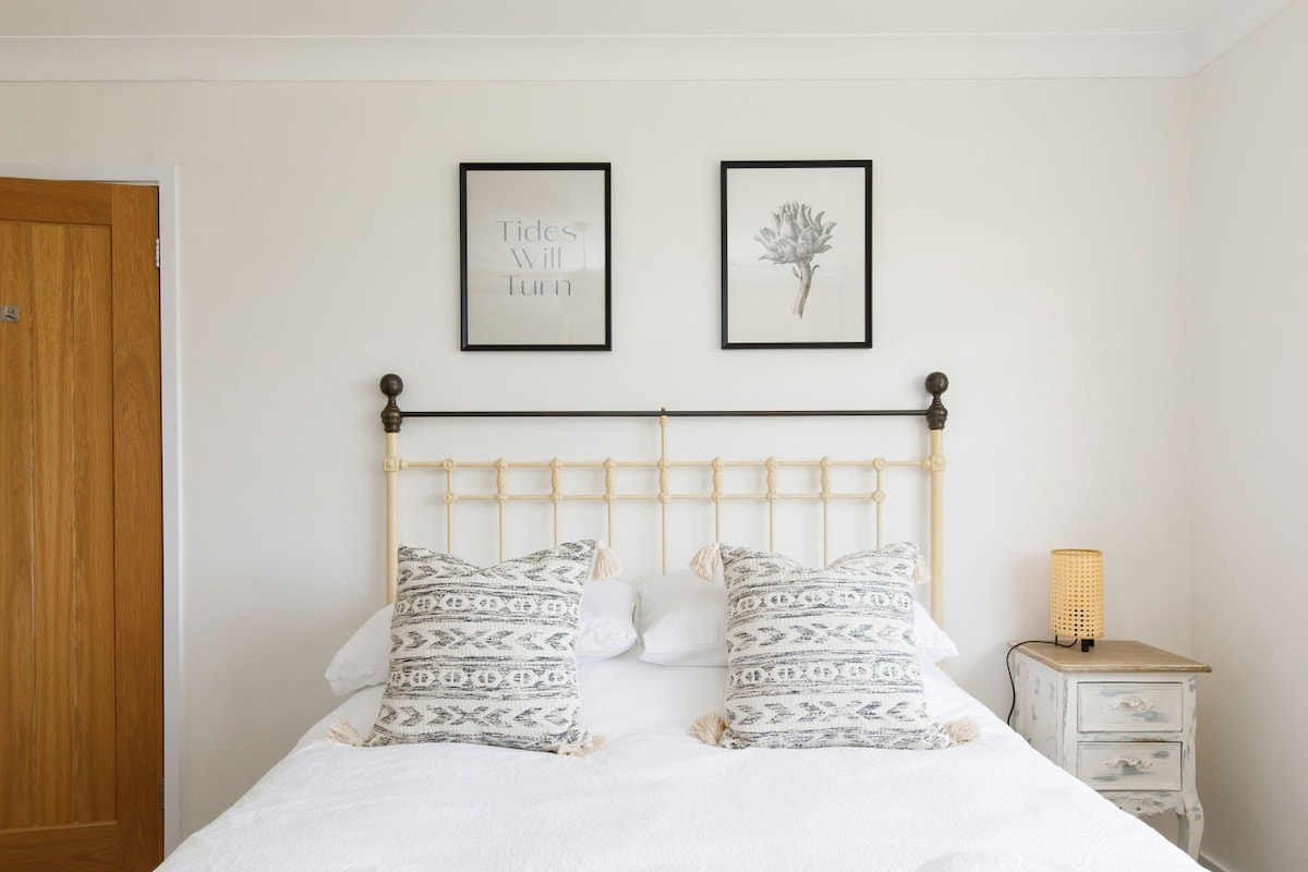 A light and airy master room with a rustic feel.