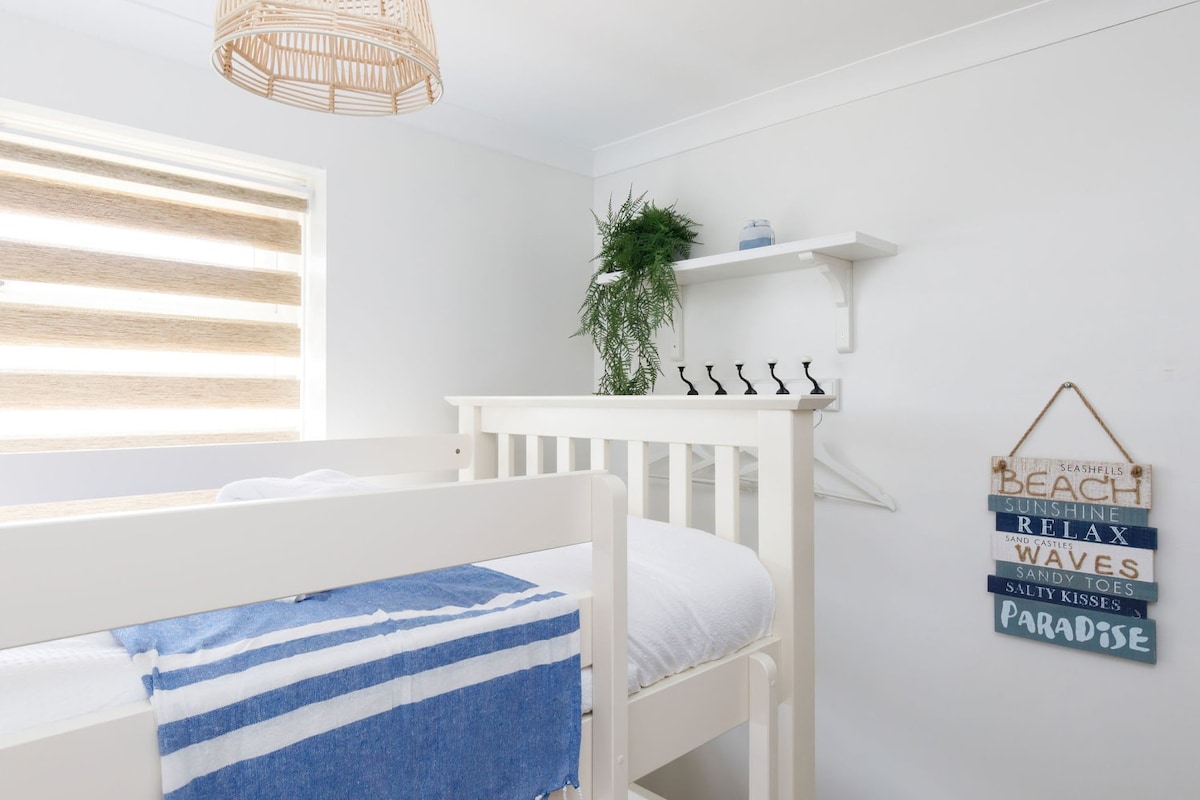 The bunkroom has a cosy beach feel with its decor.