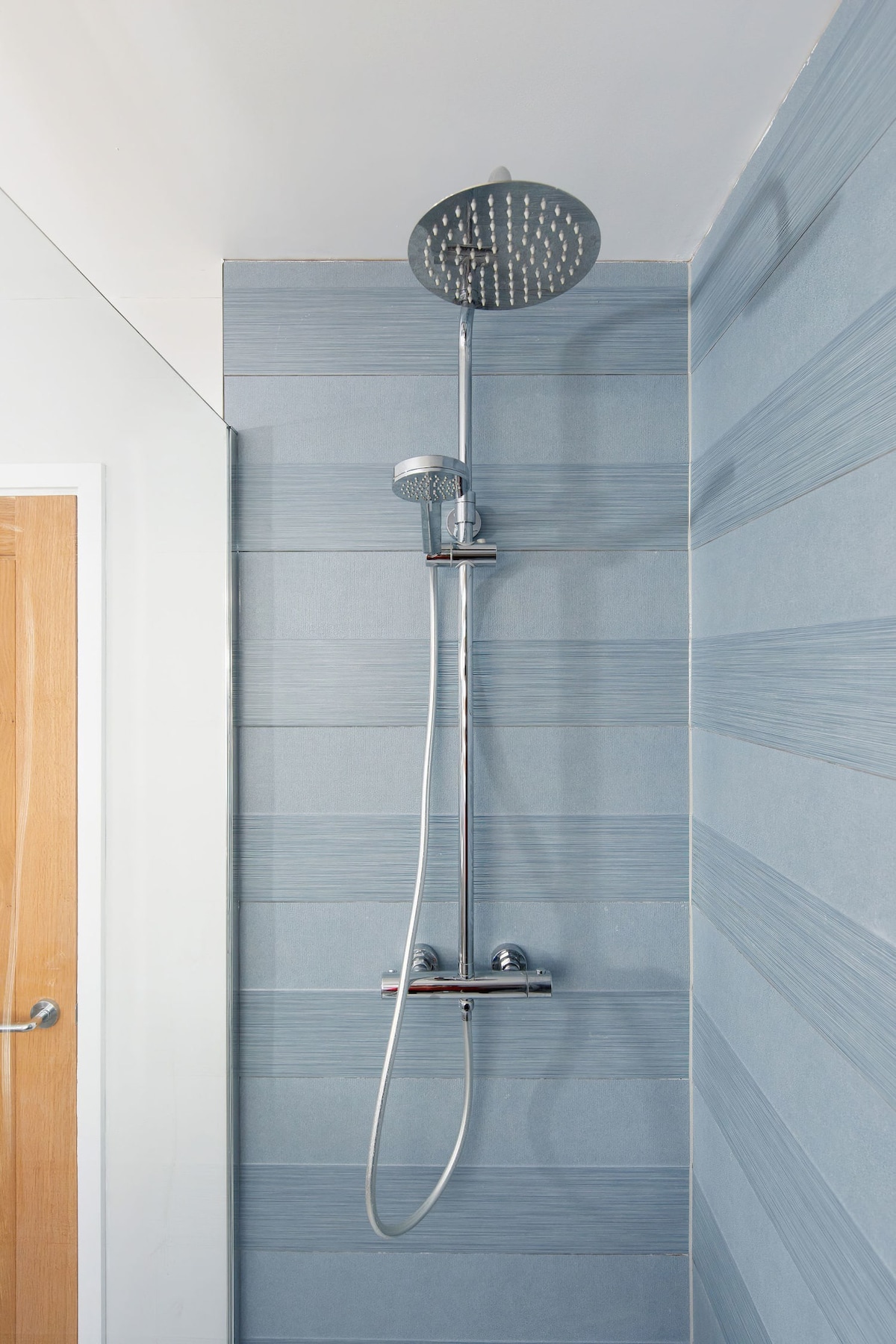 There is a walk-in shower, stocked with essentials and fresh towels.