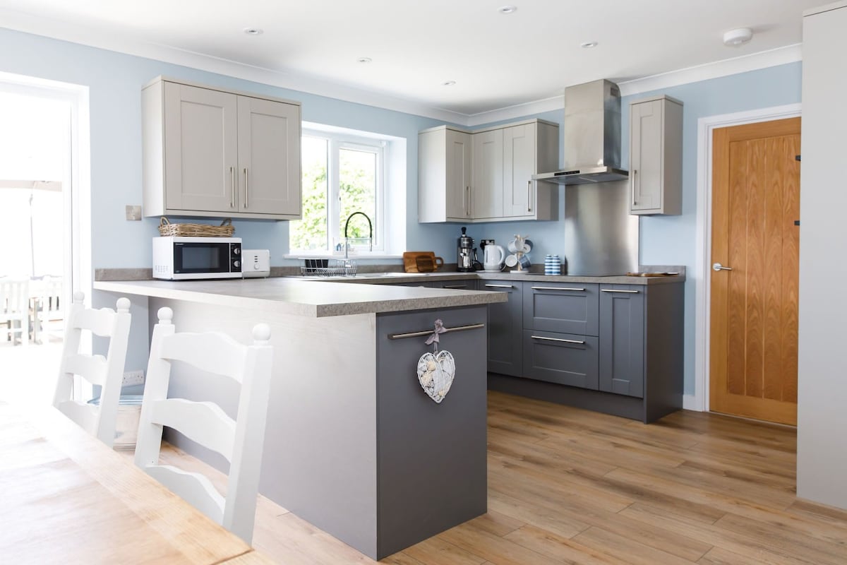 Prepare hearty meals in the L-shaped kitchen, thoughtfully designed and packed with modern appliances.