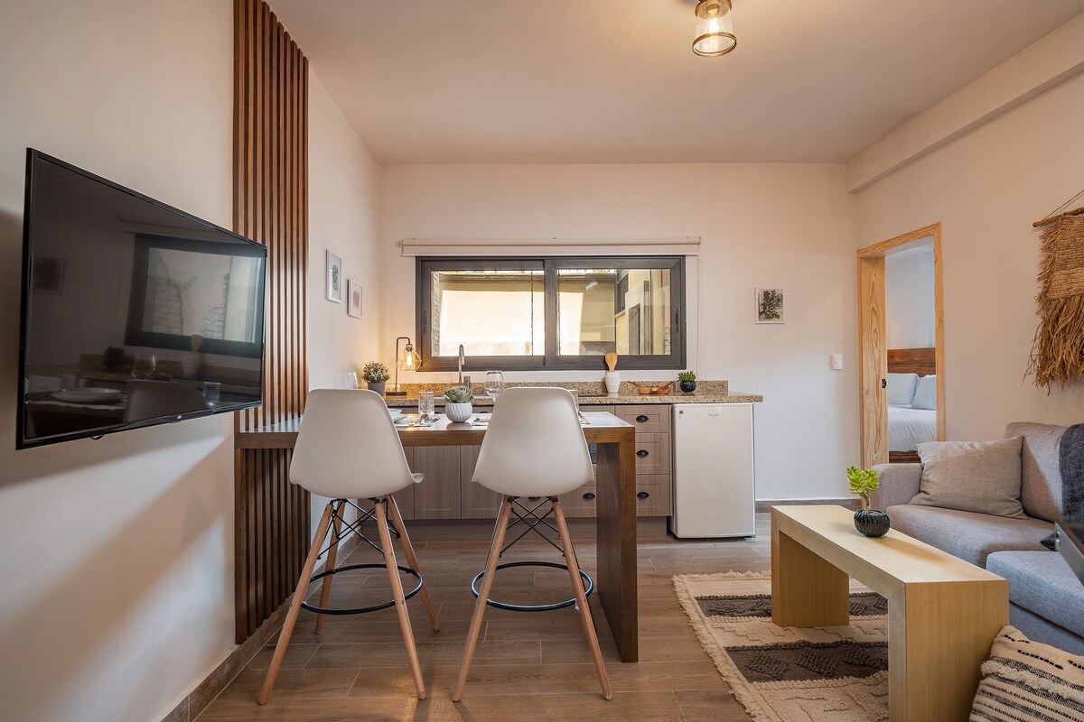 Living area with TV, dining and kitchen