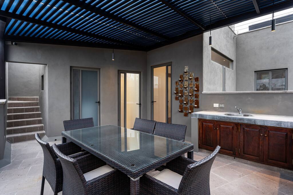 Patio with outdoor kitchen and dining