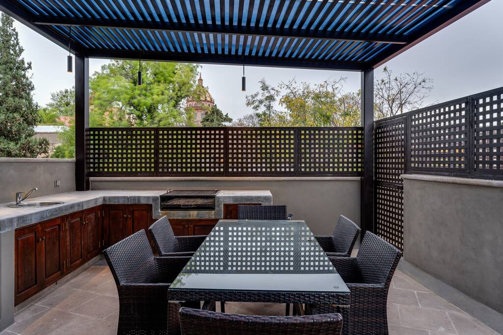 Patio with outdoor kitchen and dining