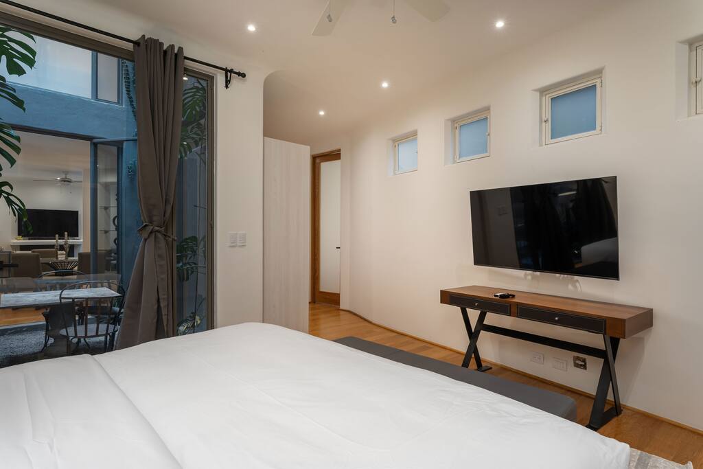 Ground floor bedroom with patio and king size bed