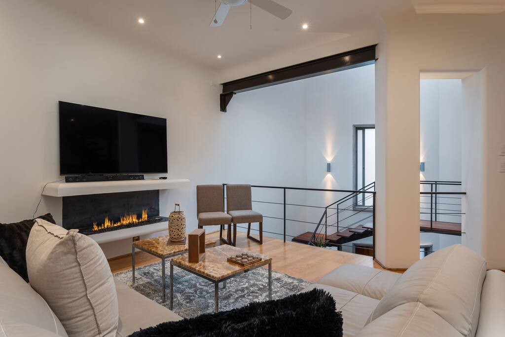 2nd living room with TV and fireplace