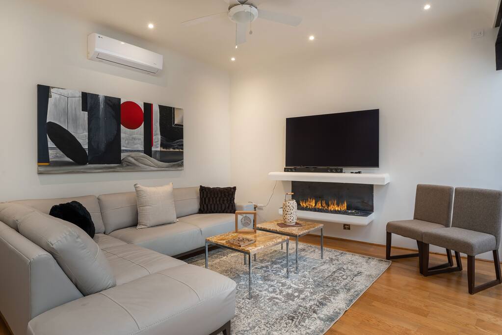 2nd living room with TV and fireplace