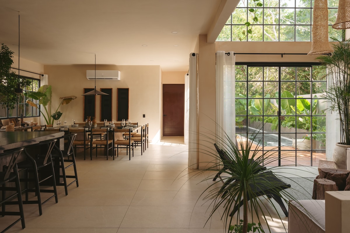 Open-concept ground floor with kitchen, dining area, and living room.