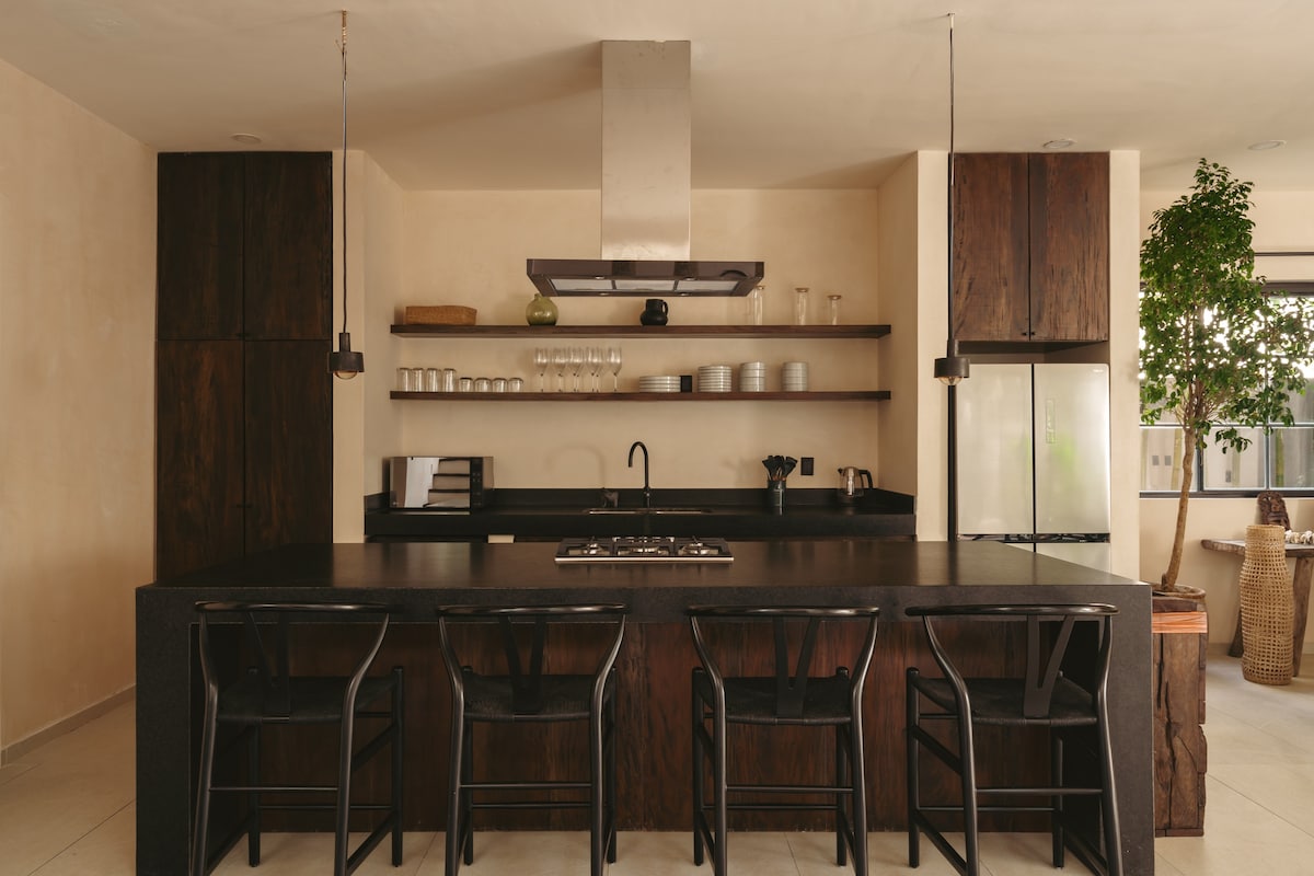 Fully equipped kitchen with modern appliances.