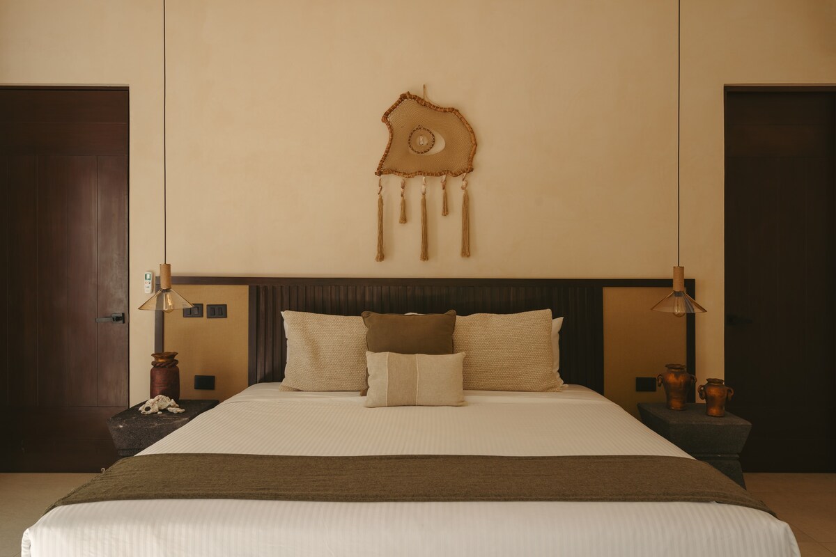 Spacious bedroom with a king-size bed, located on the ground floor.