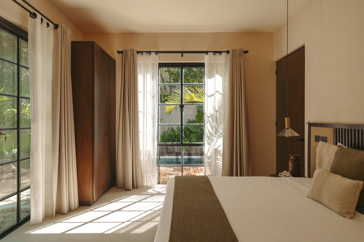 Spacious ground floor bedroom with a view of the backyard.