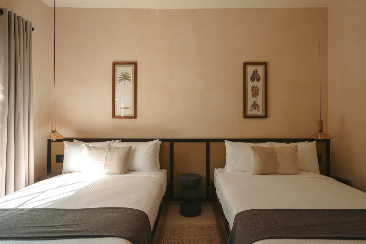 Bedroom with two beds located on the second floor.