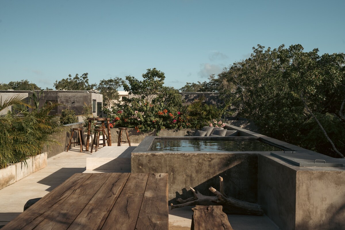 Property terrace with incredible views, includes a plunge pool, grill, and outdoor dining area.
