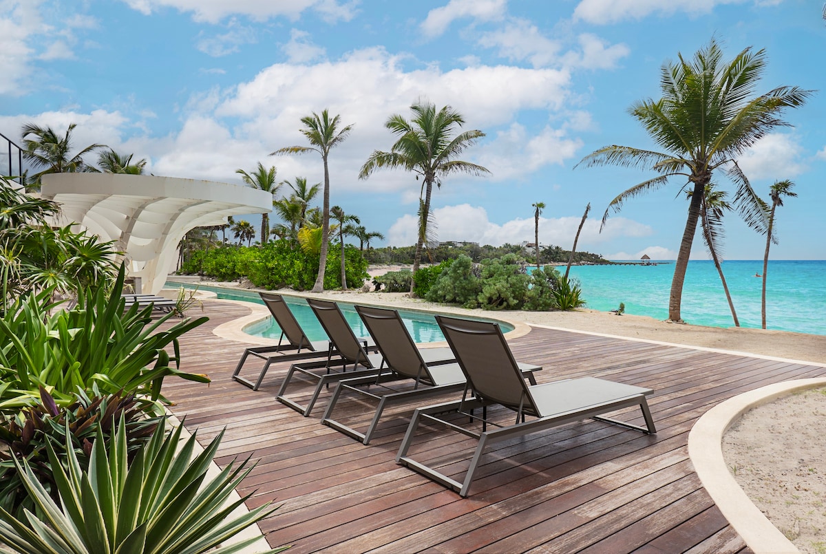 Sundeck in the complex with lounge chairs and unique ocean views.