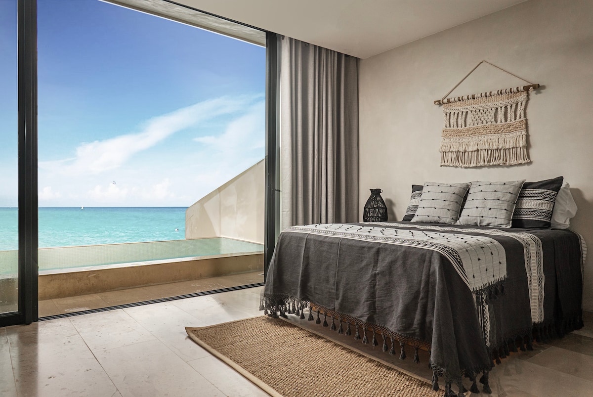 Incredible room with a spacious bed and fantastic ocean views.