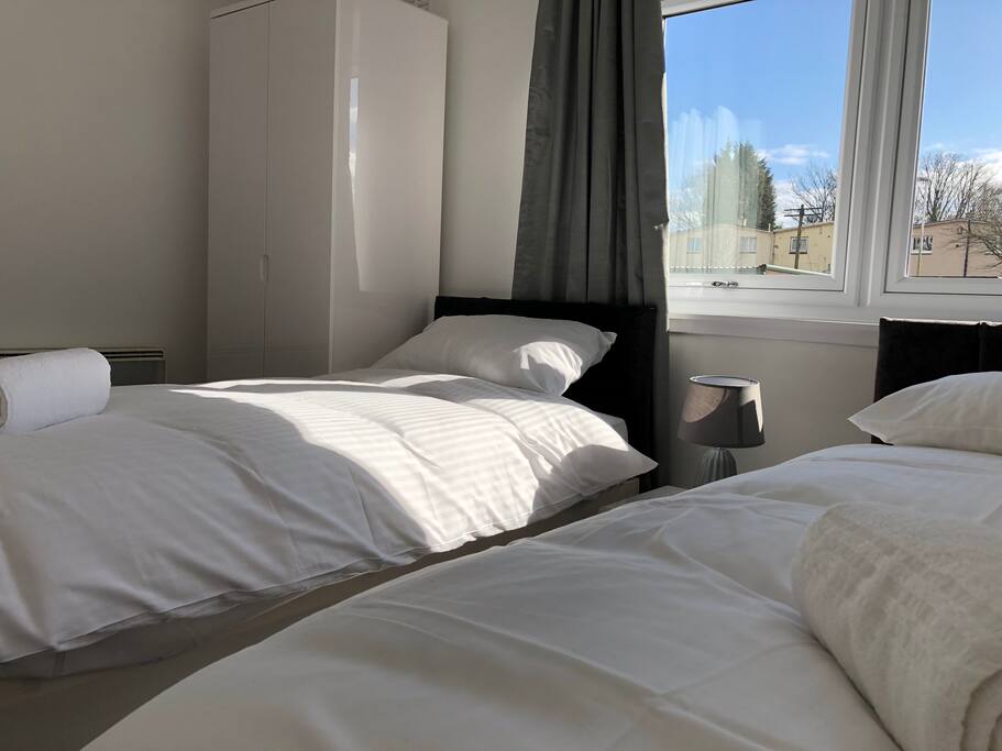 bed to window and wardrobe