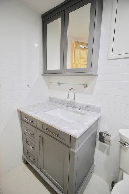 Private, Beautiful Upper Eastside Townhome — Guest Bath - Lower Level