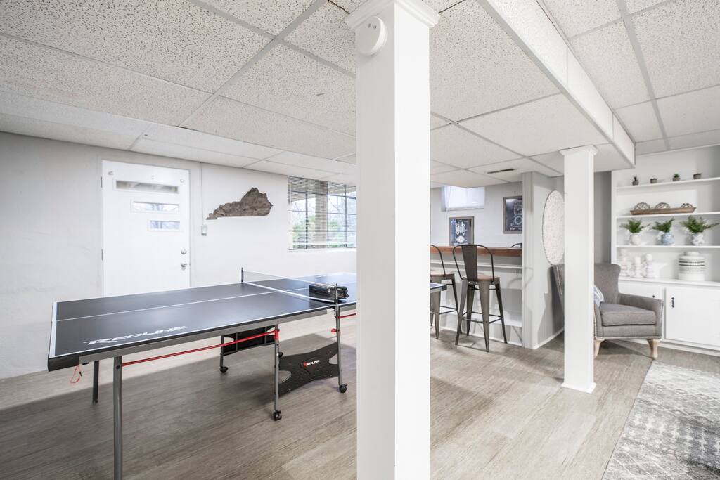 Challenge the family to ping pong or pull up a bar stool for drinks — this basement hangout is built for competitive nights in.