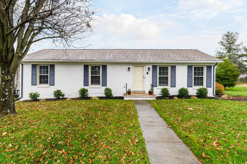 Pull the car in and feel the whole trip start — plenty of driveway for everyone's vehicles and a front yard that says you've found the right house before you even reach the door.