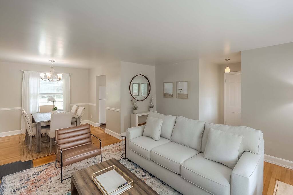 Experience luxury in our professionally decorated living room and dining room - the perfect setting for a memorable stay!