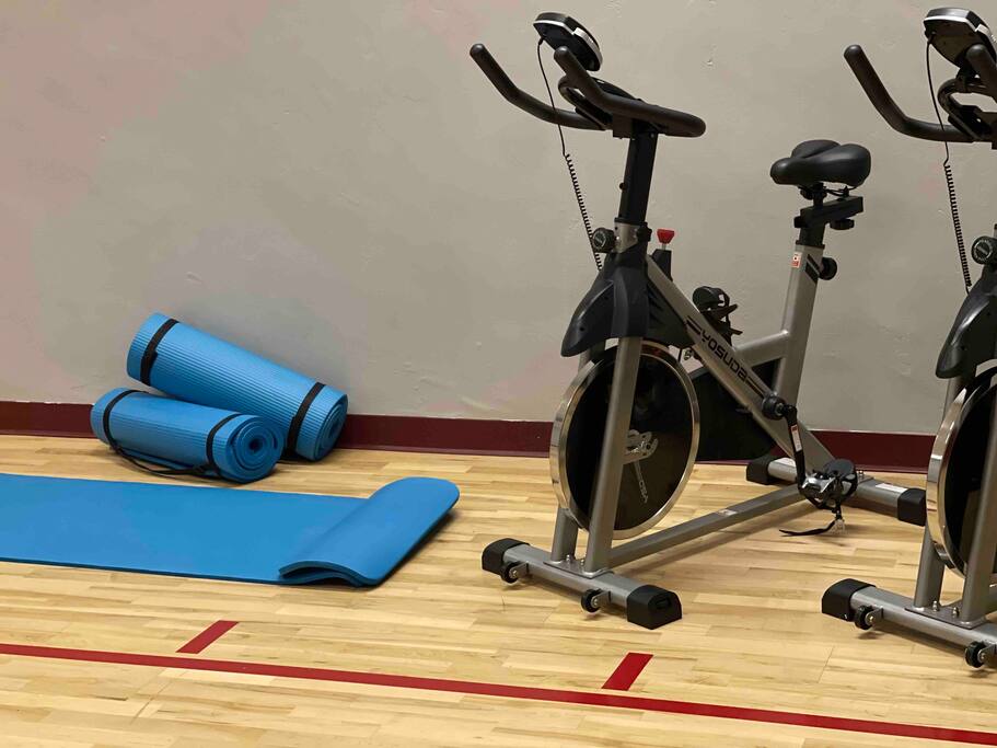Get your workout on with spin bikes and yoga mats.