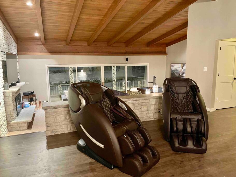 Living area features two high end massage chairs.