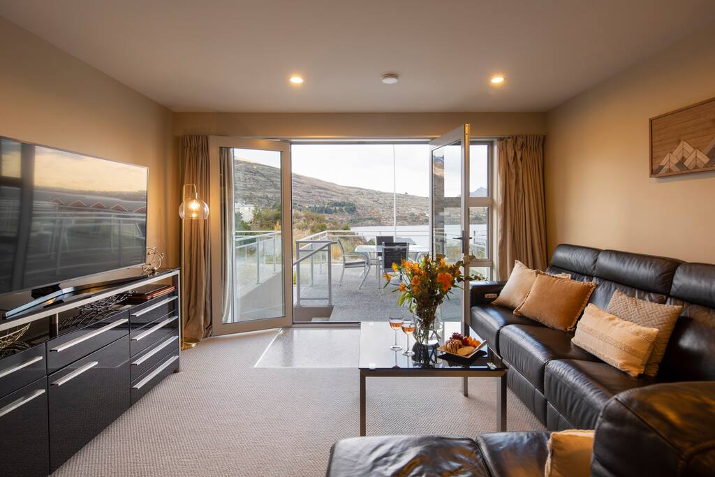 Living area with stunning lake views at your Queenstown holiday apartment