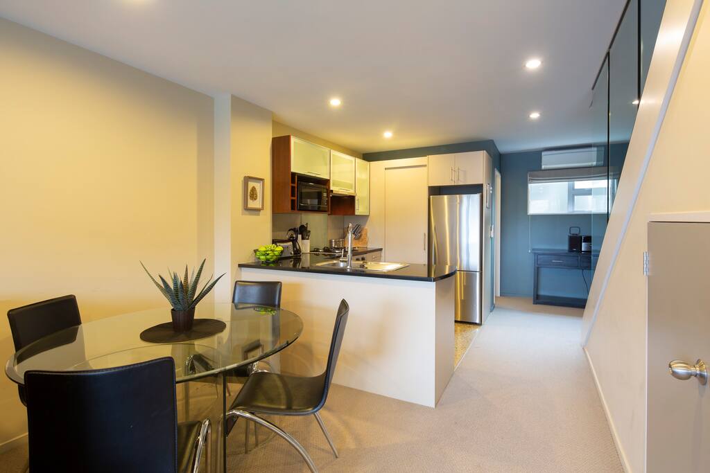 Open plan dining and lounge area in your Queenstown luxury accommodation