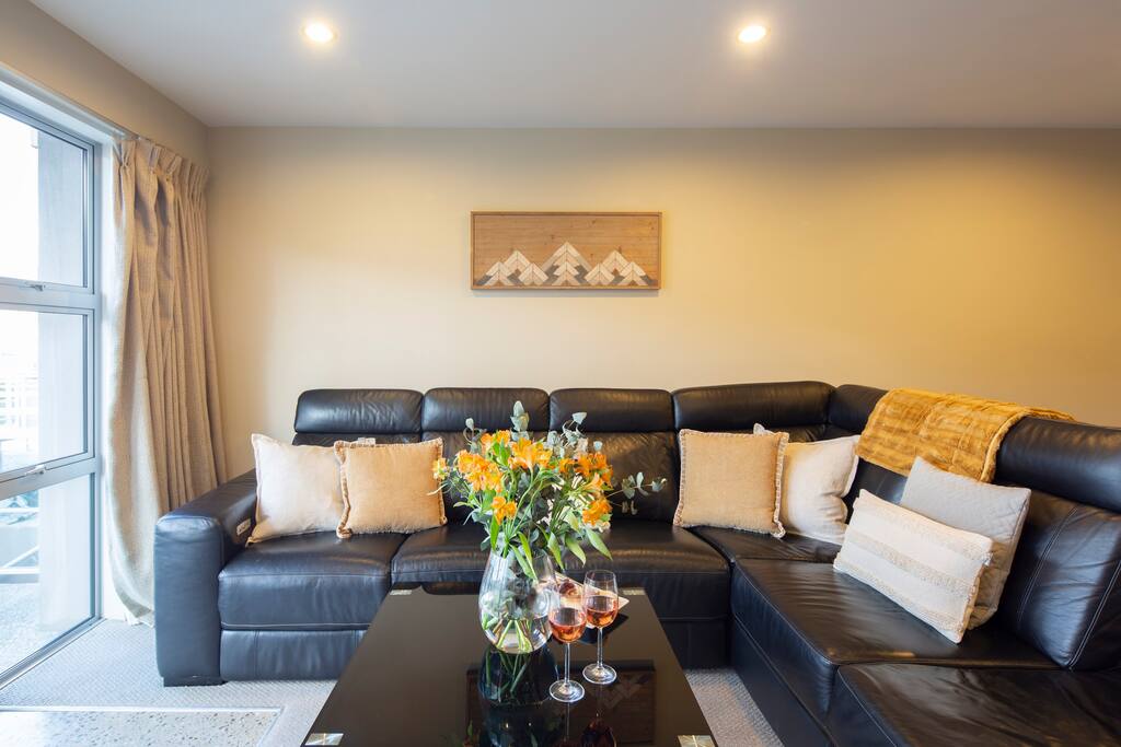 L-shaped couch for entertaining at 5 star accommodation in Queenstown