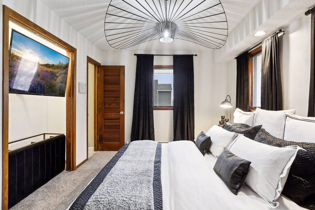 King-size comfort in Bedroom #1 on the main level, a blend of modern elegance and restful nights.