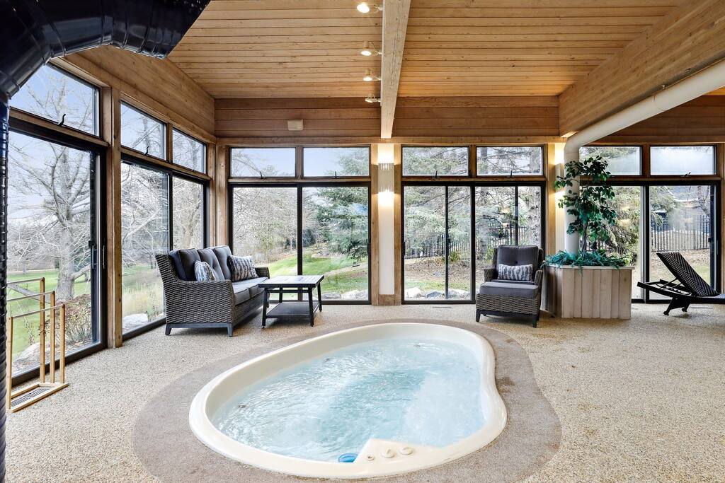 Immerse yourself in comfort in our spacious hot tub, a warm centerpiece for relaxation and leisure, surrounded by nature's beauty.