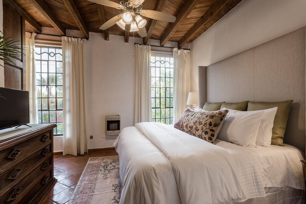 Luxury King Bed with Floor-length Curtains and Blackout Shades