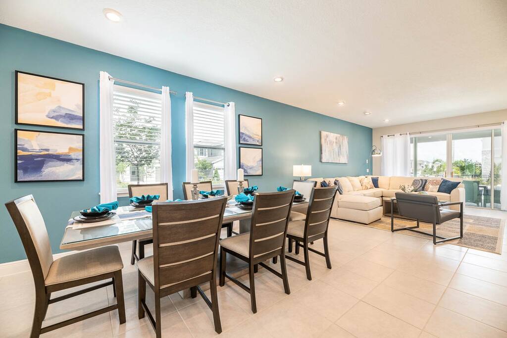 Experience comfort and style in this open-plan living and dining area, perfect for family gatherings with ample natural light and chic decor.