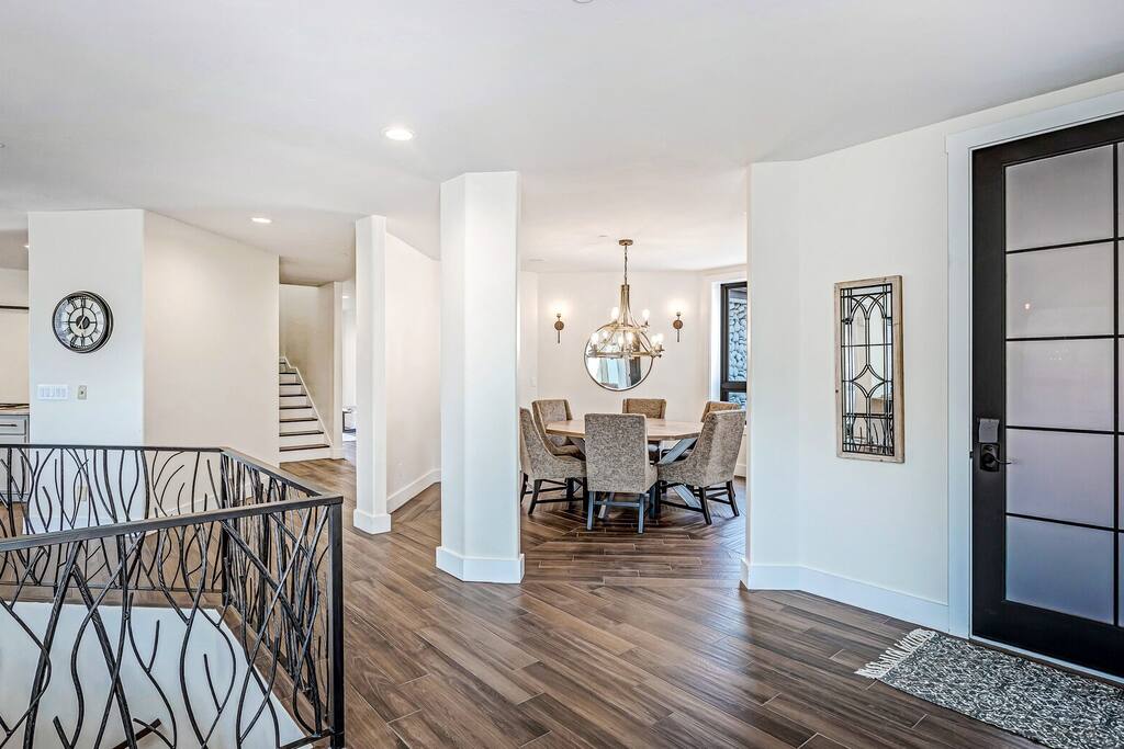 Entry hallway w/ sleek flooring and a welcoming, uncluttered feel.