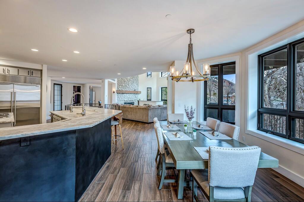 Open dining space w/ modern table and clean lines, perfect for shared meals.