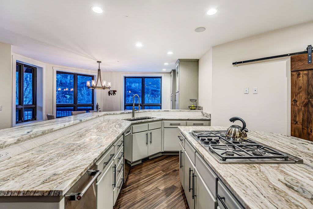 Spacious kitchen w/ large island and ample prep space for cooking together.