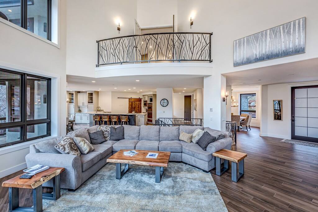 Living room anchored by a stone fireplace, perfect for cozy gatherings