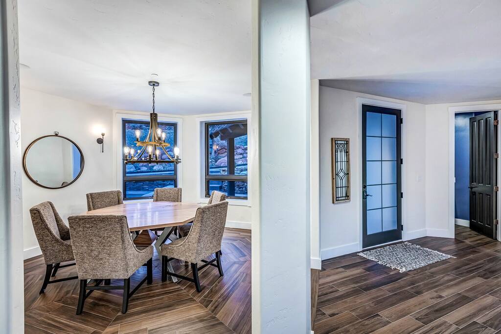 Casual breakfast nook w/ seating and bright windows to start the day.
