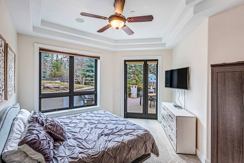 Serene bedroom featuring a comfortable bed and calming neutral tones.