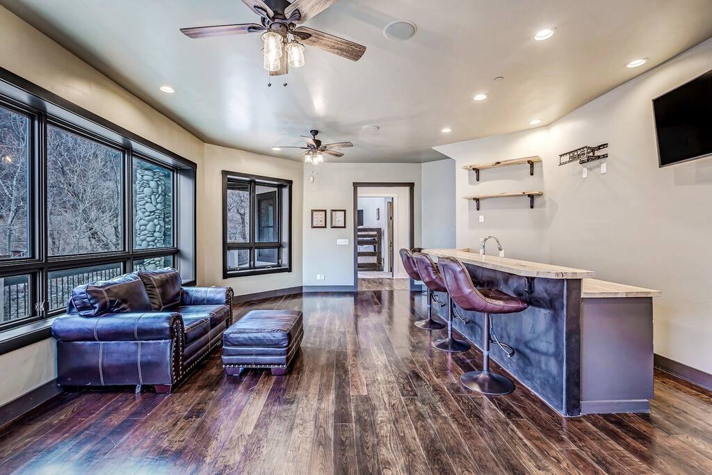 Open living space w/ large windows bringing the outdoors in.