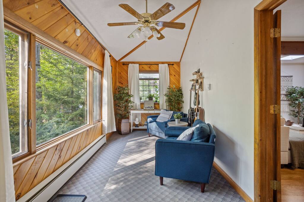 Sunroom Lounge with Forest View
Surrounded by windows and warmed with natural light, this peaceful sunroom is a perfect place to sit back, read, or just enjoy the view.
